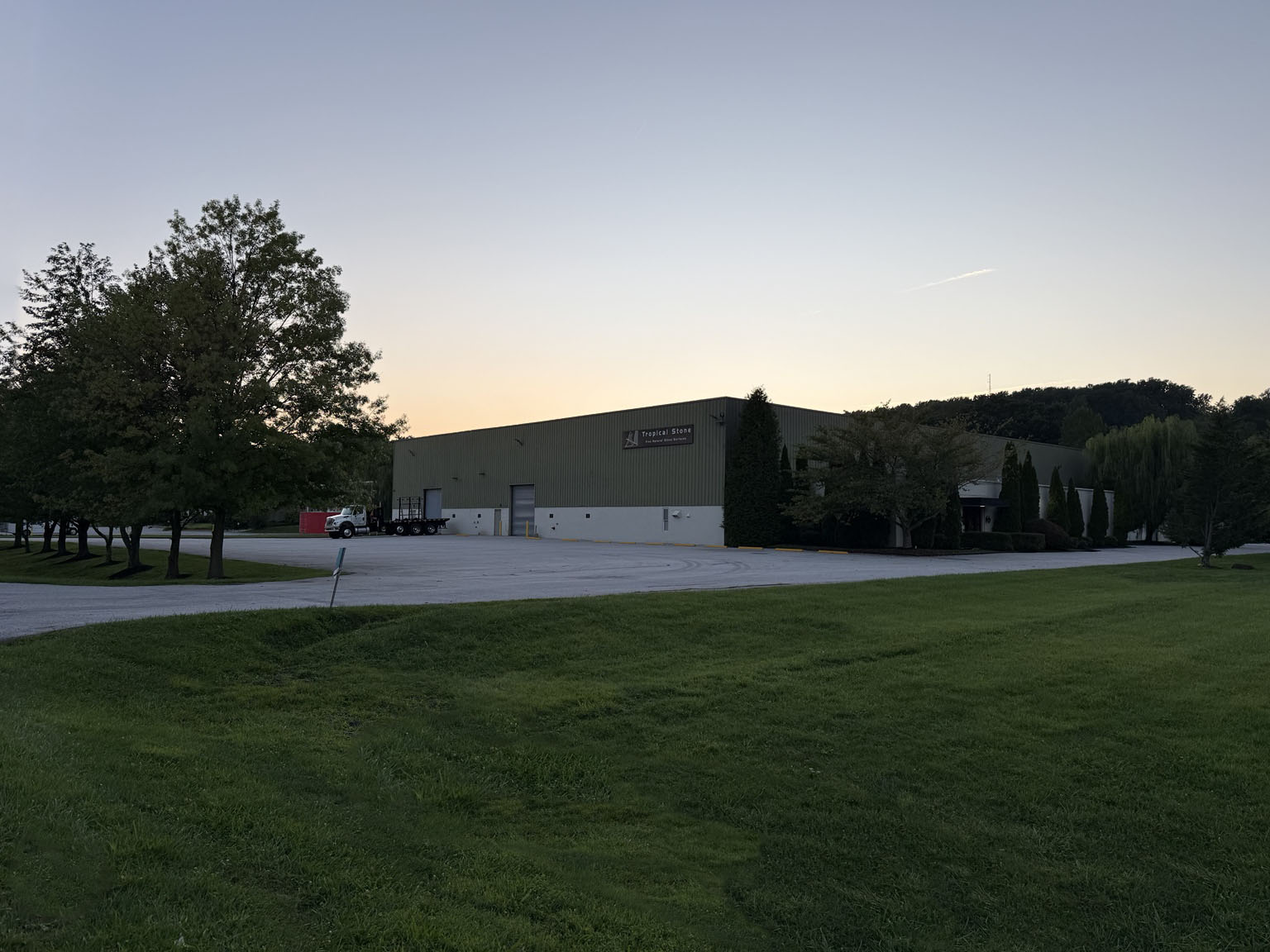Tropical Stone showroom exterior at dusk