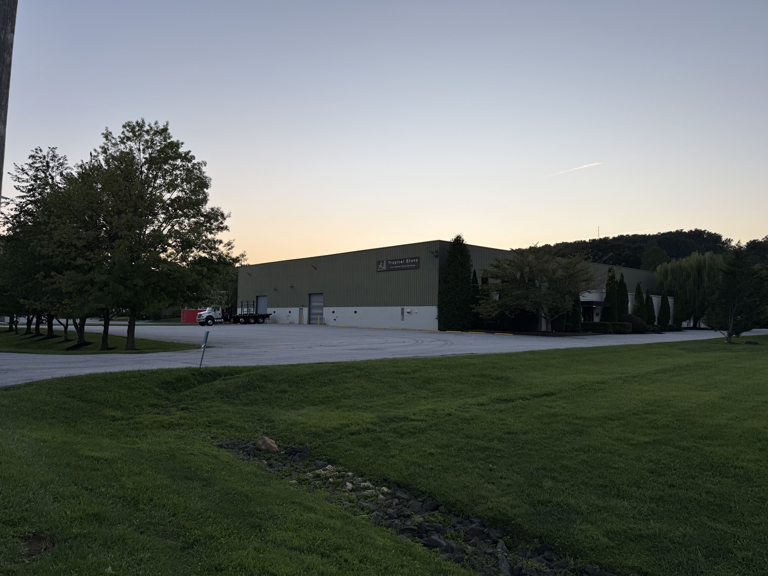 Tropical Stone showroom exterior at dusk